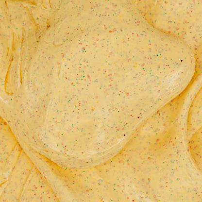 Close up texture of yellow putty with multicolored specs.